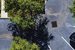 Aerial shot of clubhouse, courtyard and pool