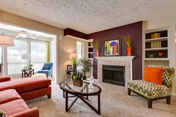 Living Room Living Room with fireplace and looking into sunroom - Photo Gallery 5