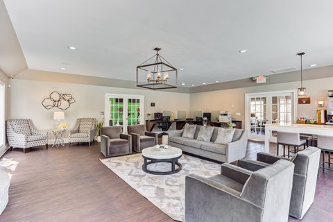 A living room with a grey sofa set and a coffee table.