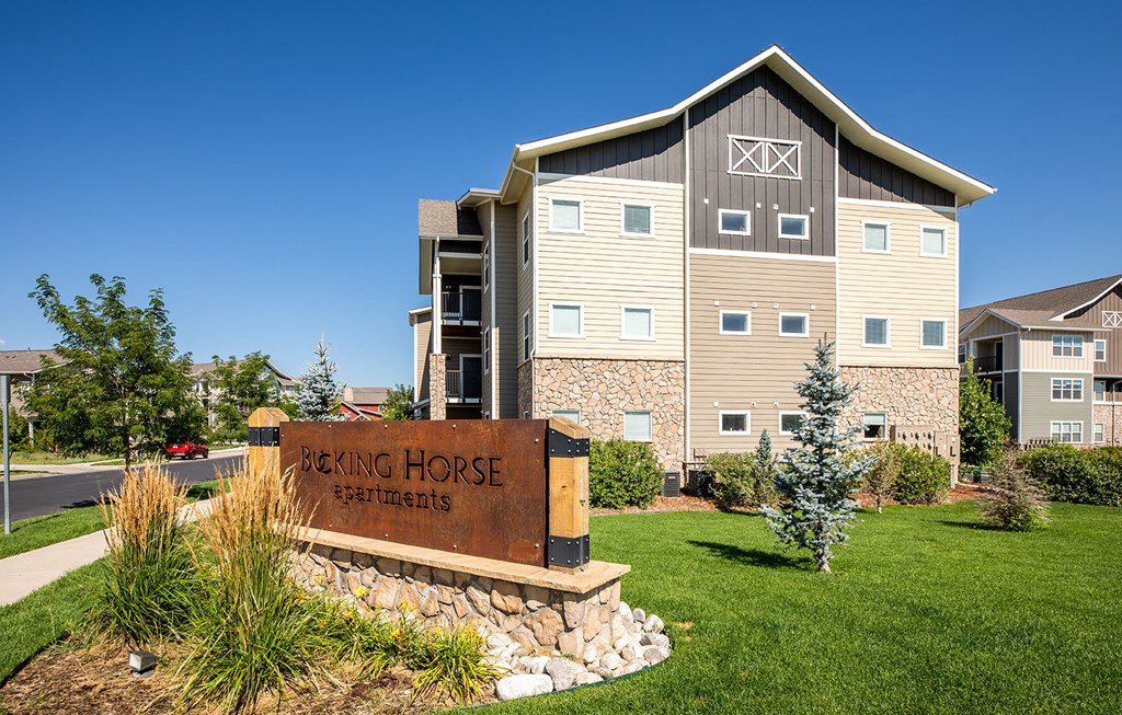 Apartment building and sign for Bucking Horse apartments