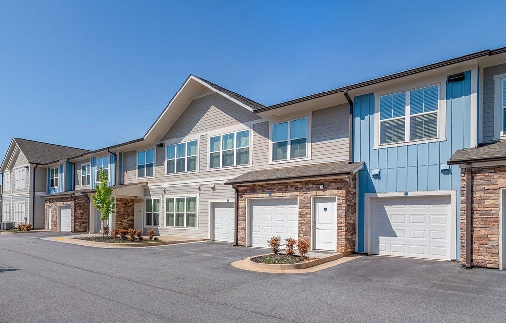 a row of houses with a street in front of them at Carmel Vista, Georgia, 30253
