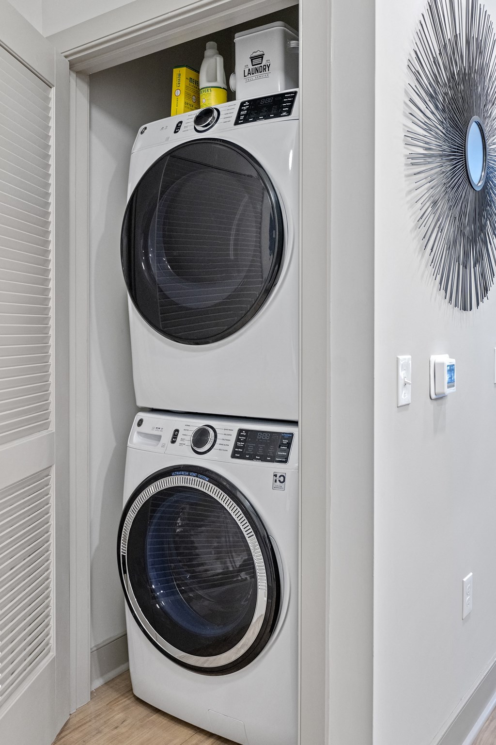 a washer and dryer in a laundry room at The Harrison, Newtown Square, Pennsylvania