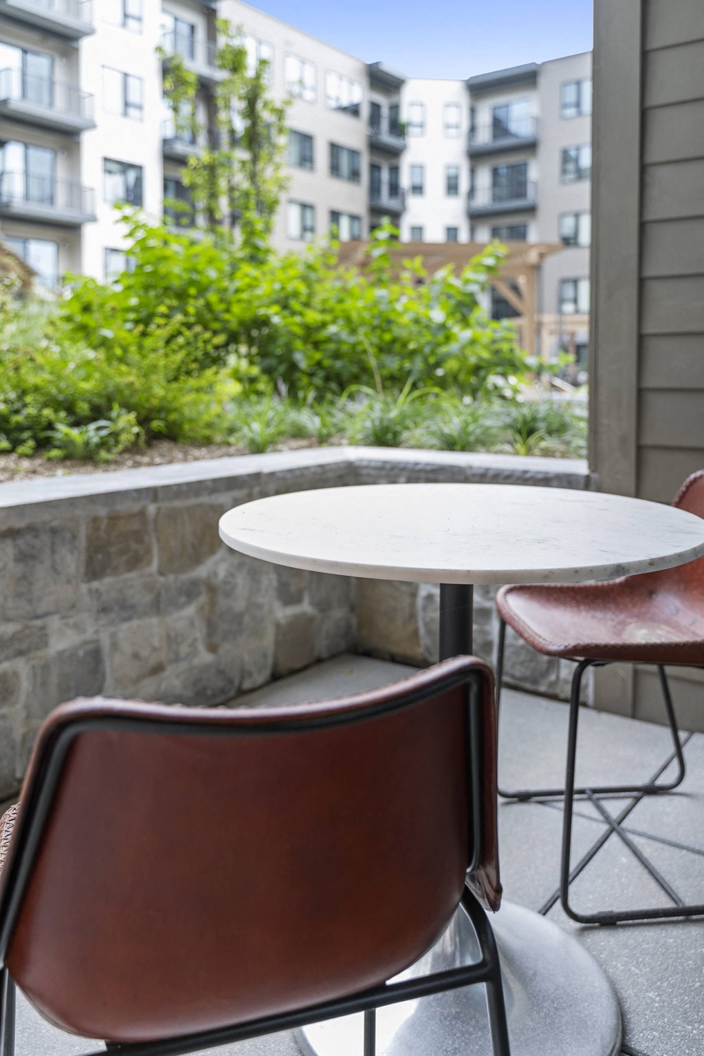 a table and two chairs on a balcony at The Harrison, Newtown Square, Pennsylvania