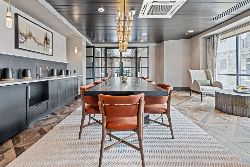 a dining room with a long table and chairs at The Harrison, Newtown Square, 19073