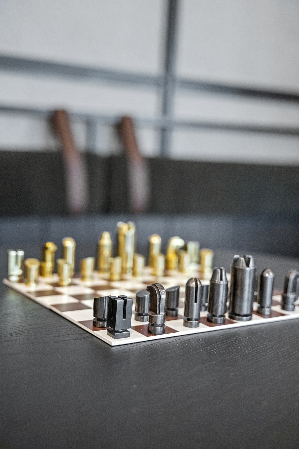 a chessboard on a table with a chair in the background at The Harrison, Pennsylvania