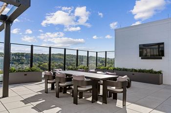 a terrace with a table and chairs and a view of the city at Madison West Elm, Pennsylvania