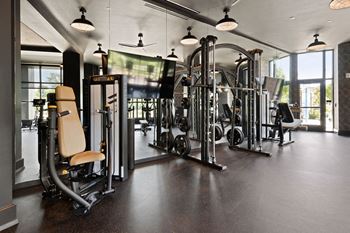 A gym with a variety of equipment including a leg press machine at Madison West Elm, Pennsylvania, 19428