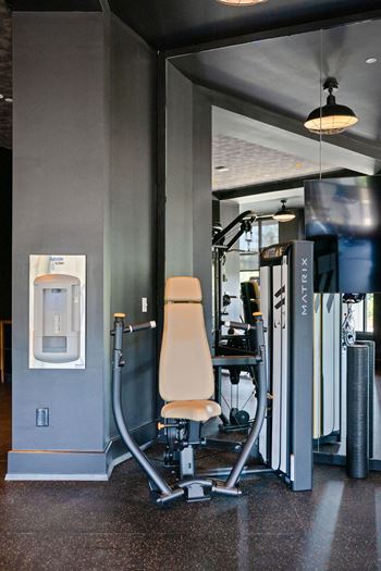 A gym with a weight machine and a treadmill at Madison West Elm, Conshohocken, PA