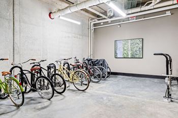 A bike rack with bicycles in a garage at Madison West Elm, Conshohocken, PA 19428
