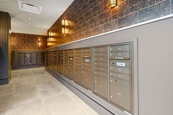 the mail room is equipped with mailboxes and cabinets at Madison West Elm, Conshohocken, PA 19428