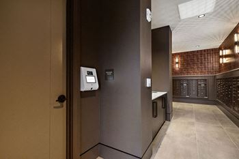 a view of a hallway with a door to a wine cellar at Madison West Elm, Conshohocken, PA