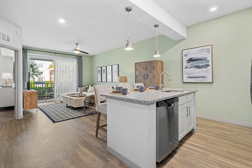 a kitchen with a sink and a counter top at Inspira, Naples, 34113