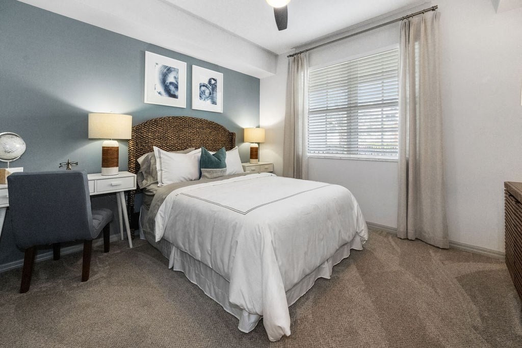 a bedroom with a bed and a desk at Inspira, Florida, 34113