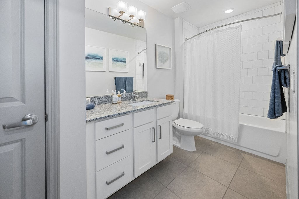 a bathroom with a sink and a toilet and a shower at Inspira, Naples, FL