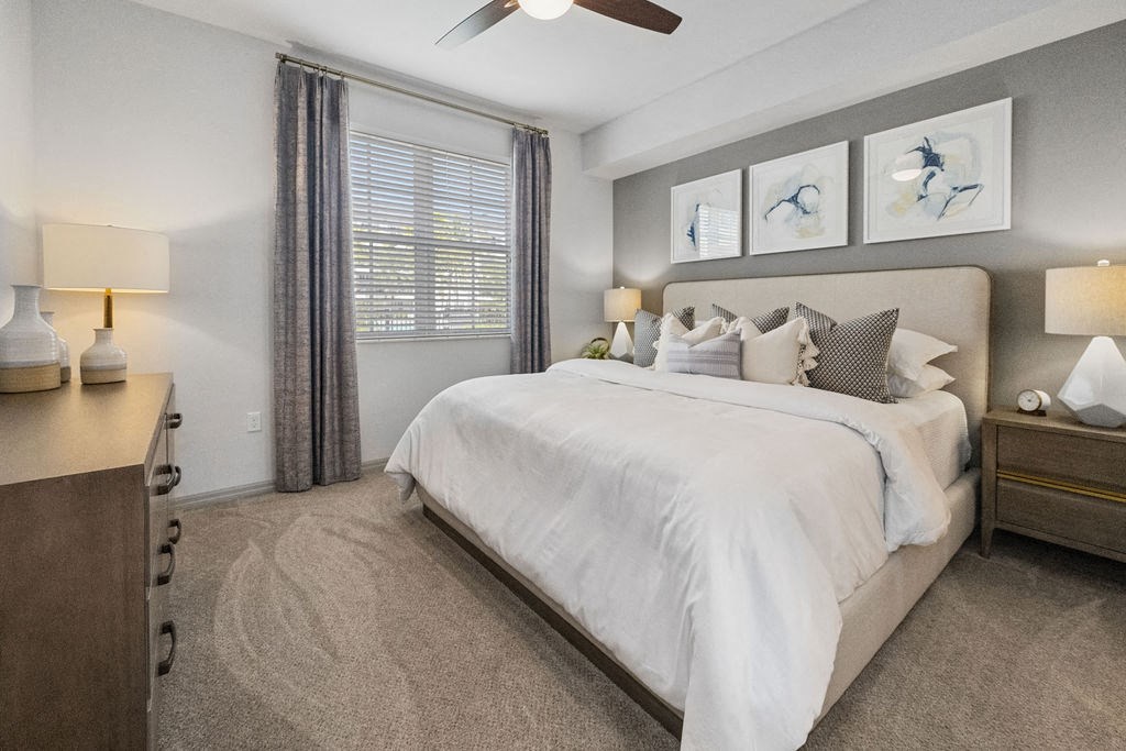 a bedroom with a large bed and a window at Inspira, Naples, FL, 34113