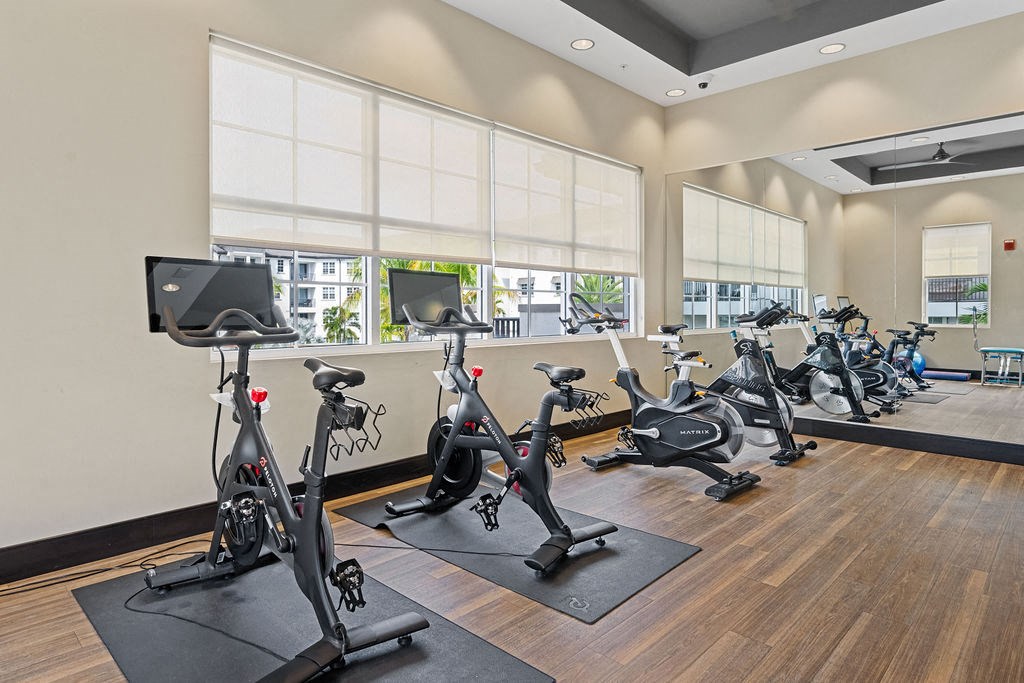 a gym with exercise bikes and other fitness equipment at Inspira, Naples, FL, 34113