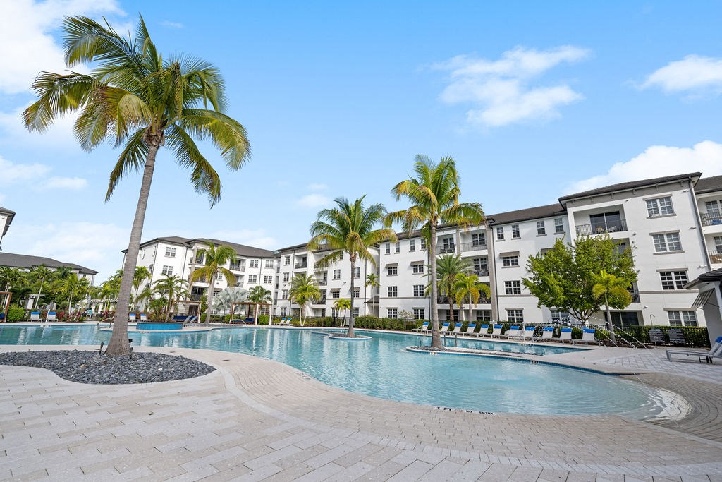 Pool with curves and palm trees at Inspira, Florida