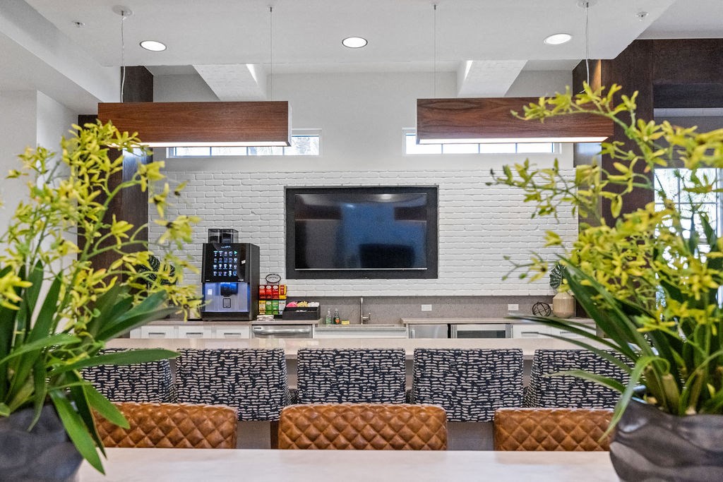 Clubhouse kitchen with gourmet coffee machine with complimentary coffee for residents at Inspira, Florida, 34113
