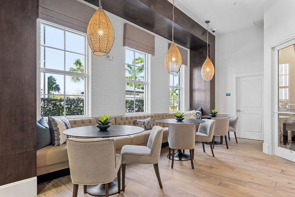 Booth type seating with tables and chairs at Inspira, Florida, 34113