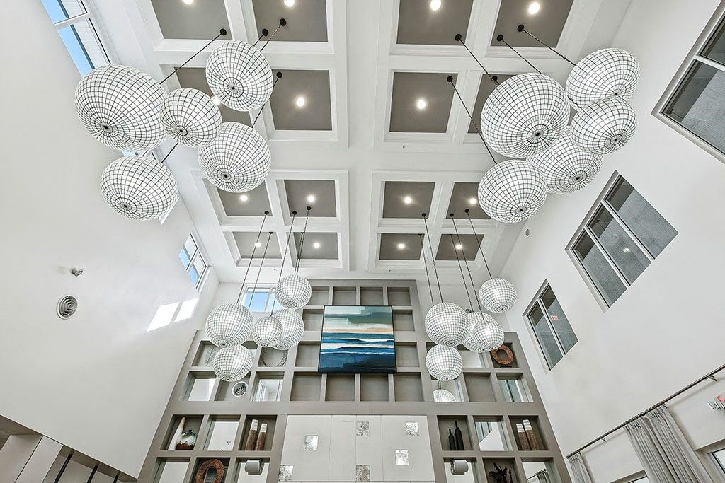 a view of the lobby of a building with spheres hanging from the ceiling at Inspira, Florida, 34113