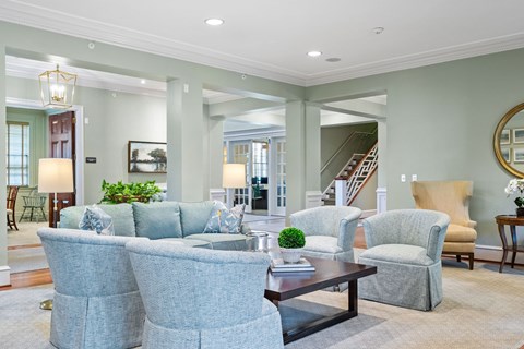 A living room with a grey couch and a coffee table.