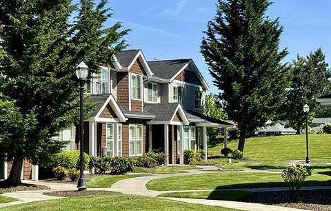 a house with a sidewalk in front of it