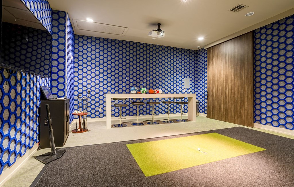 a room with a table and a television in it  at The Parkway on Westlake, Humble, Texas