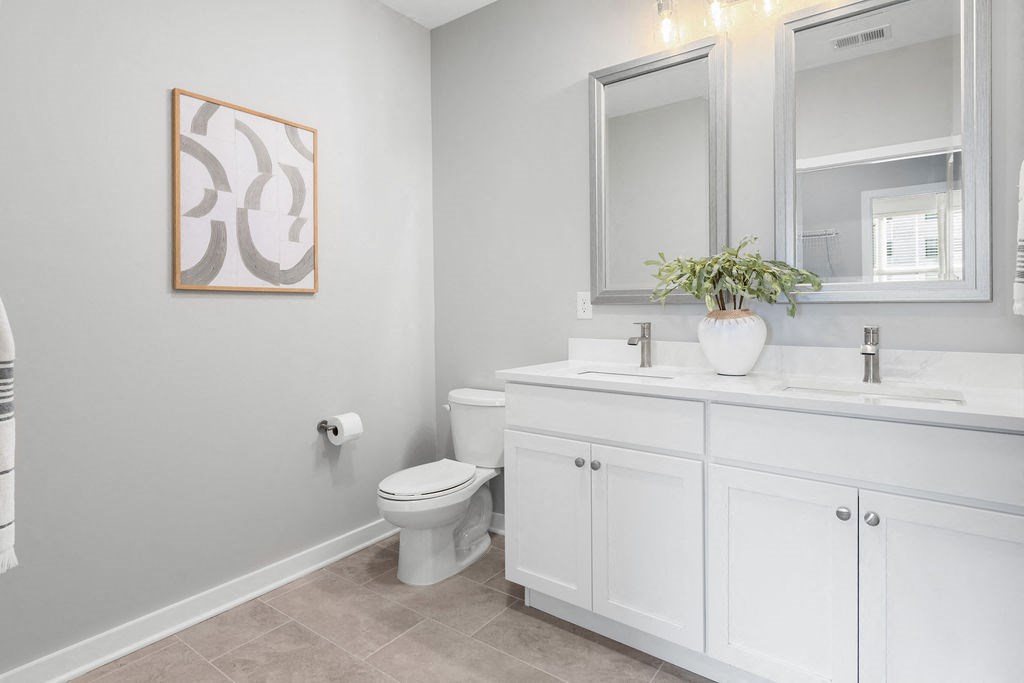 a bathroom with a toilet and a sink and a mirror at Madison Prickett Preserve, Yardley