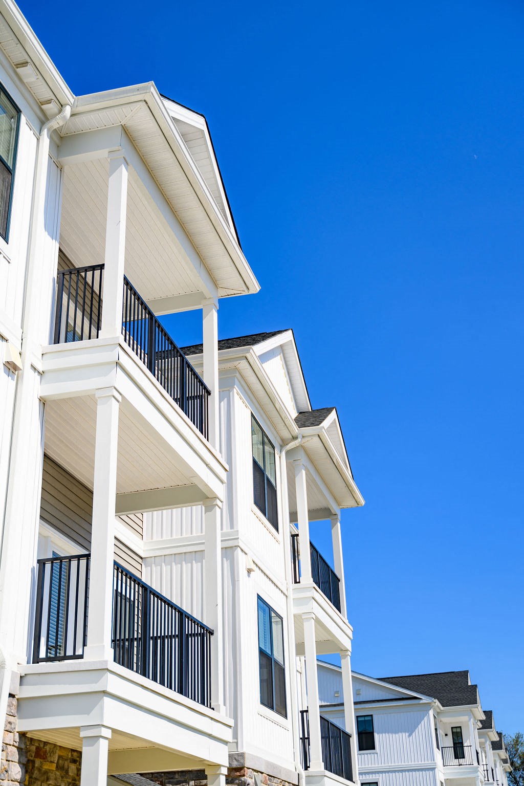 A white building with balconies and railings at Madison Prickett Preserve, Yardley Pennsylvania