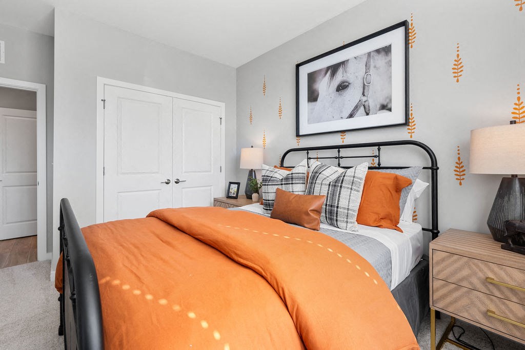 A bedroom with a bed, nightstand, and lamp at Madison Prickett Preserve, Yardley, 19067