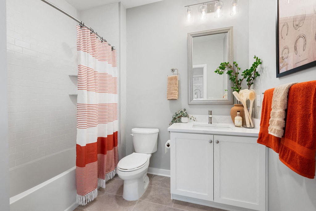 a bathroom with a shower and a toilet and a sink at Madison Prickett Preserve, Yardley