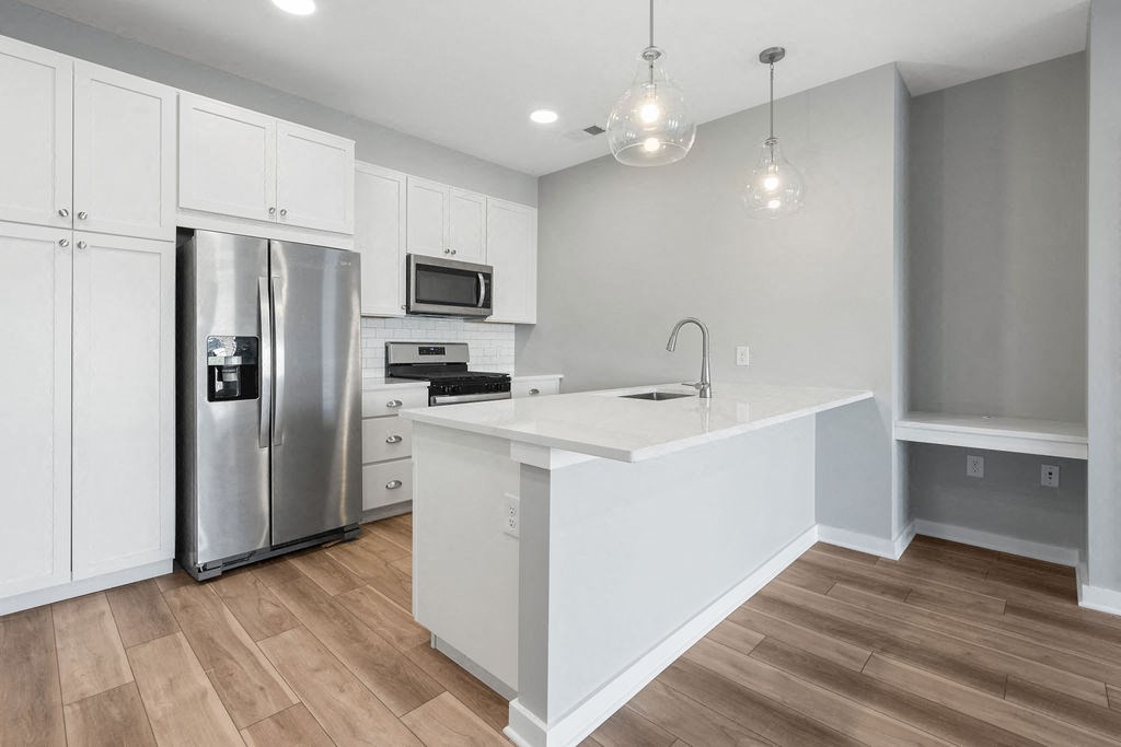 a large white kitchen with a stainless steel refrigerator at Madison Prickett Preserve, Pennsylvania