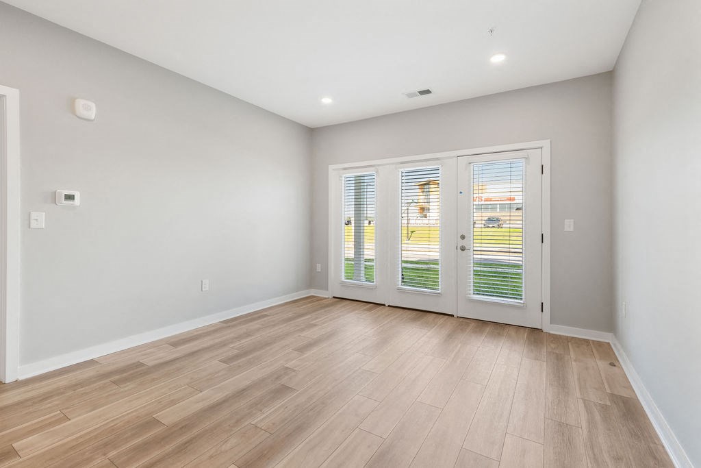 A room with a sliding glass door leading to a balcony at Madison Prickett Preserve, Pennsylvania