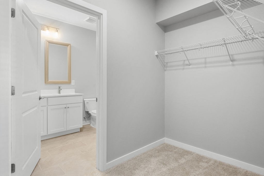 a bathroom with a closet and a toilet and a sink at Madison Prickett Preserve, Yardley, PA