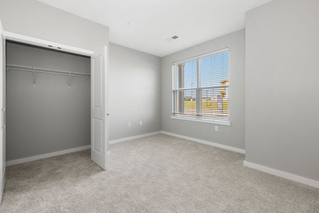 an empty bedroom with a closet and a large window at Madison Prickett Preserve, Yardley Pennsylvania