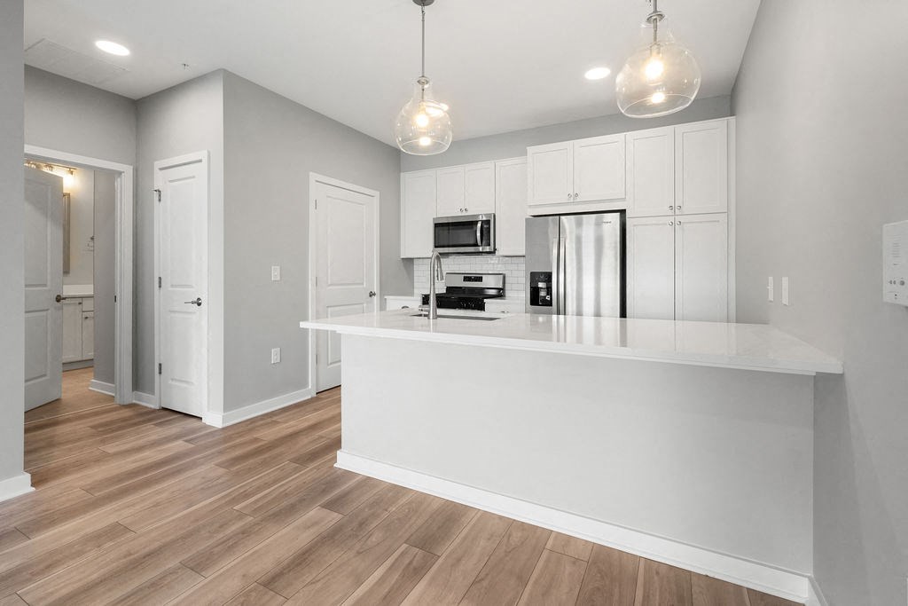 A kitchen with a white counter and a refrigerator at Madison Prickett Preserve, Pennsylvania