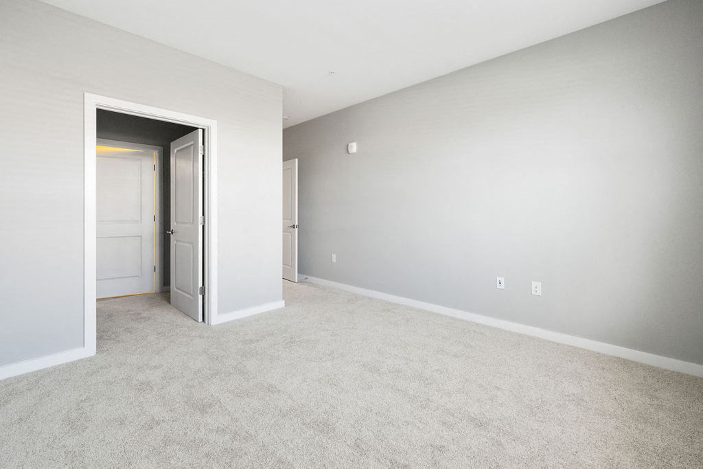an empty living room with a door to a bedroom at Madison Prickett Preserve, Pennsylvania, 19067