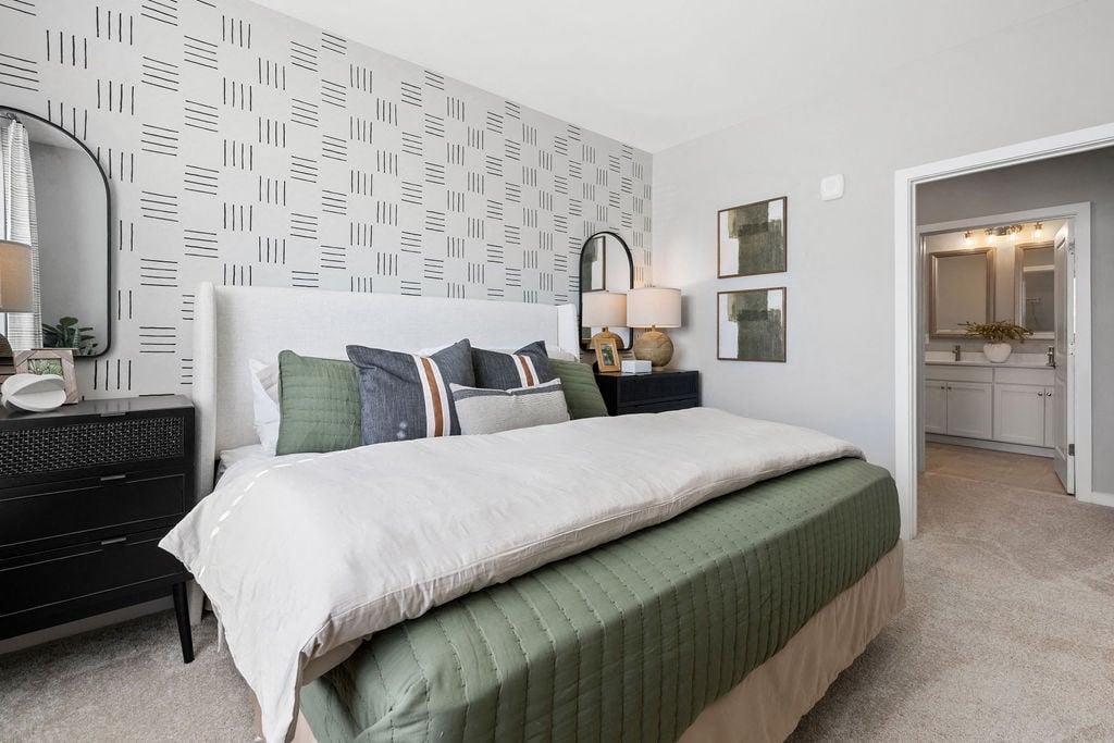 a bedroom with two beds and a hallway with a wall with stripes at Madison Prickett Preserve, Yardley Pennsylvania