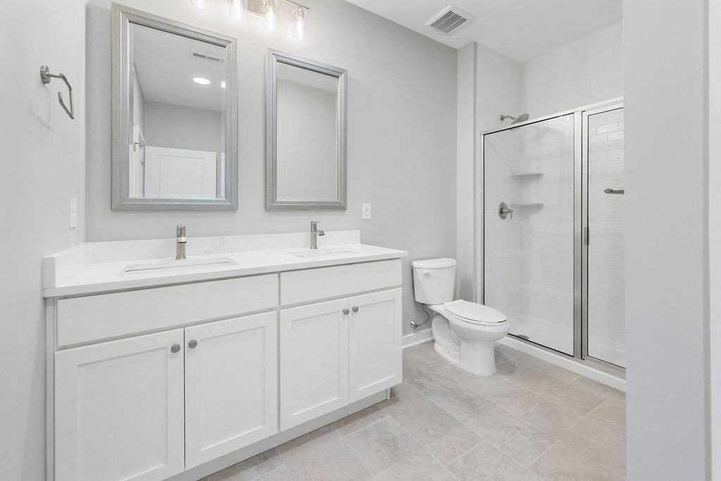 a white bathroom with a urinal and a mirror at Madison Prickett Preserve, Yardley