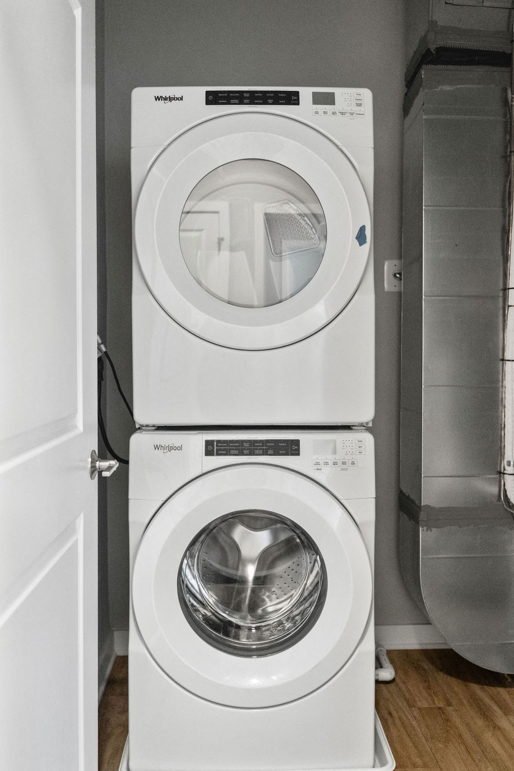 A white washing machine and dryer stacked on top of each other in a laundry room at Madison Prickett Preserve, Yardley Pennsylvania
