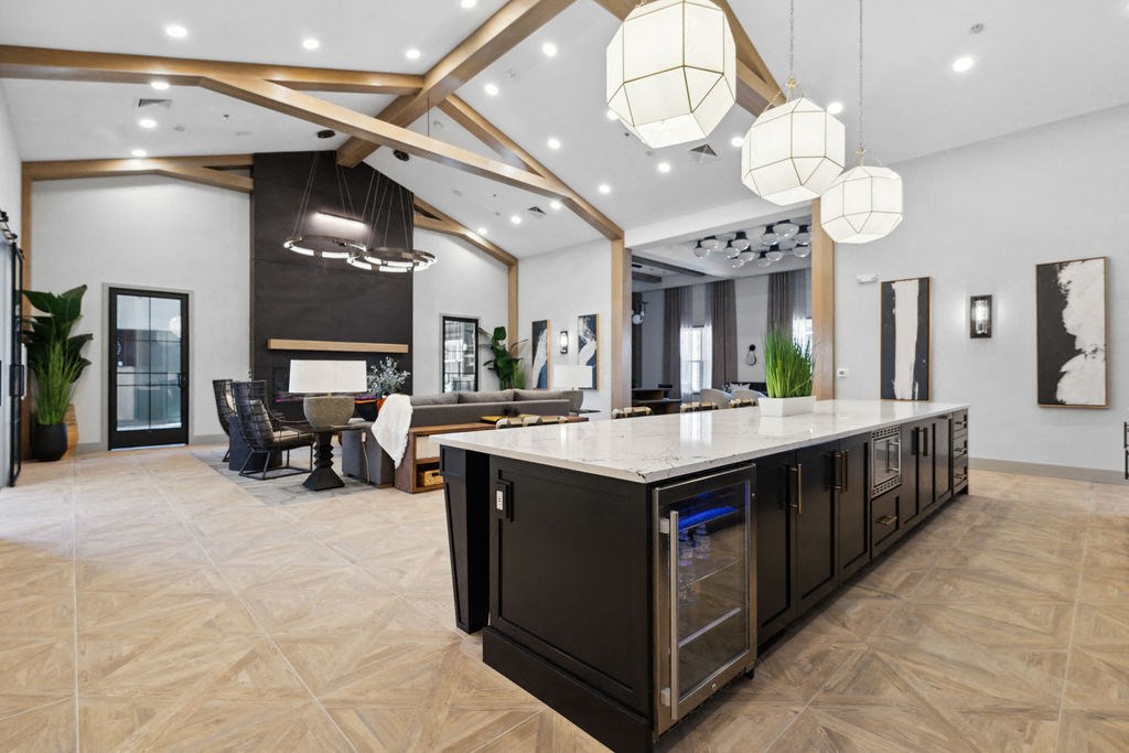 A modern kitchen with a large island and a dining area with a table and chairs at Madison Prickett Preserve, Yardley Pennsylvania