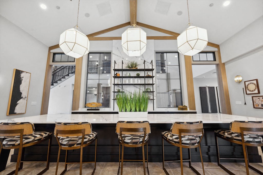 A modern dining area with a long table and chairs at Madison Prickett Preserve, Yardley