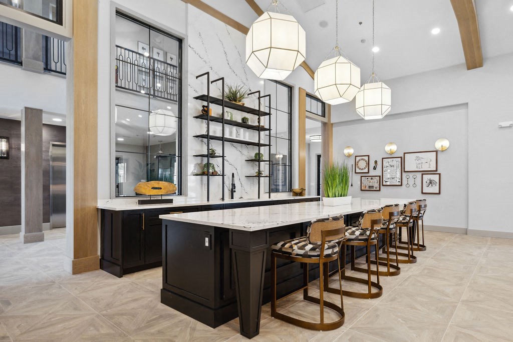 the kitchen has a long marble counter top and a long row of stools at Madison Prickett Preserve, Pennsylvania