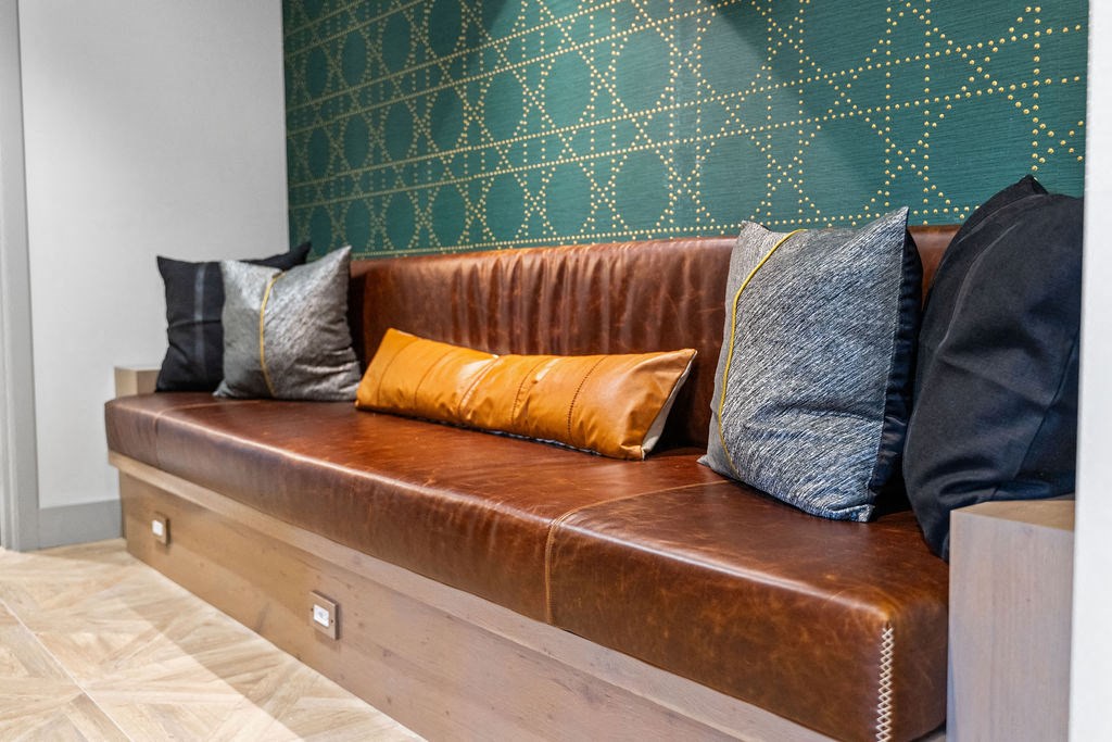 a leather couch with several pillows on it at Madison Prickett Preserve, Yardley