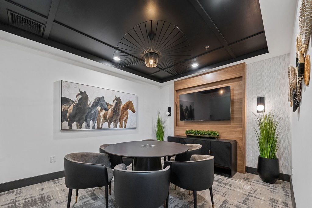 a dining room with a table and chairs and a television at Madison Prickett Preserve, Pennsylvania, 19067