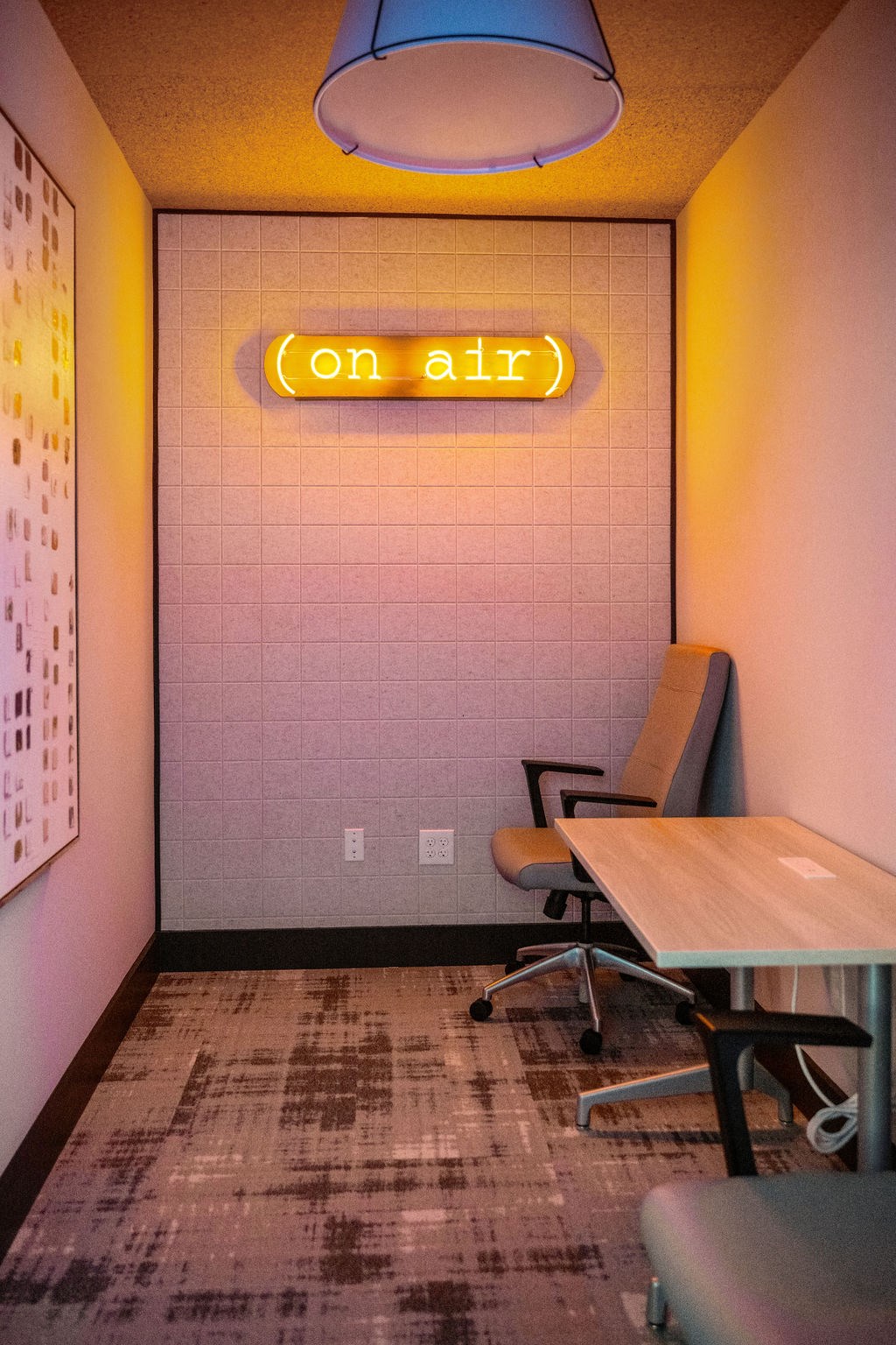 a conference room with a table and chairs and a neon sign on the wall at Madison Prickett Preserve, Yardley, 19067