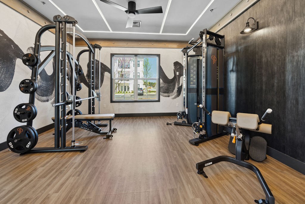 a gym with exercise equipment and a wall mural at Madison Prickett Preserve, Yardley