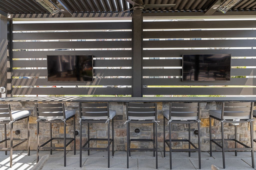 a bar with chairs and televisions on the wall at Madison Prickett Preserve, Pennsylvania, 19067