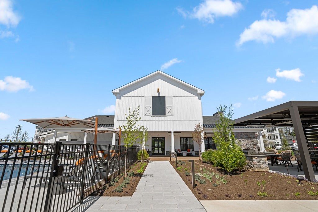 A white building with a black fence in front of it at Madison Prickett Preserve, Yardley, 19067