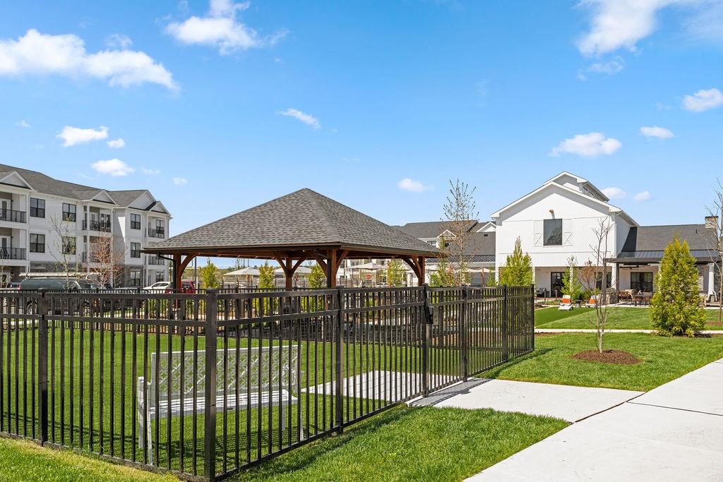 a gazebo with a bench in front of a house at Madison Prickett Preserve, Pennsylvania, 19067